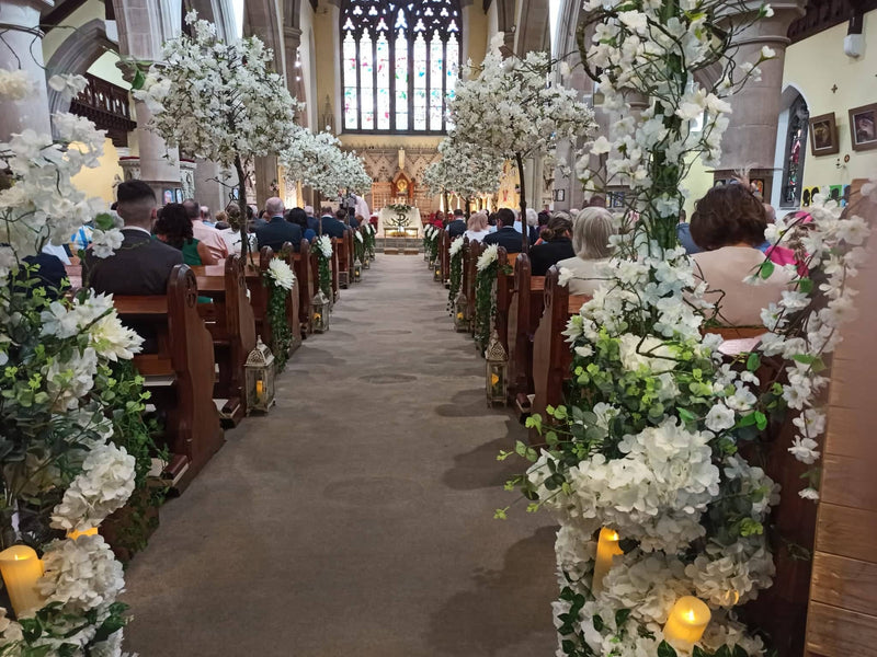 View down the aisle of our Cherry Blossom trees in a church