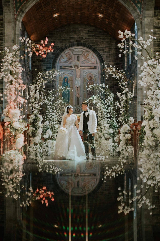 Bride and groom  surrounded by our enchanted arches