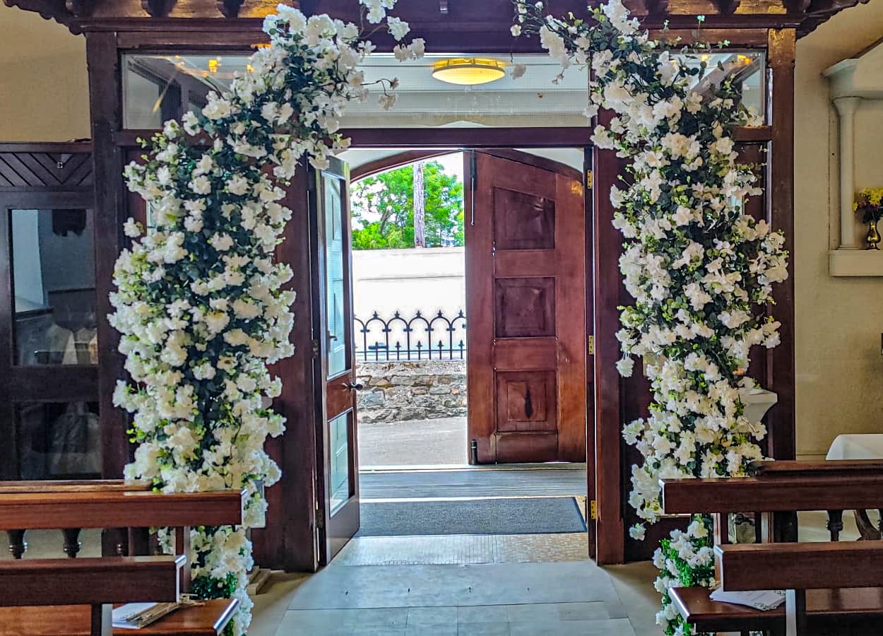 New enchanted arches at the start of the aisle